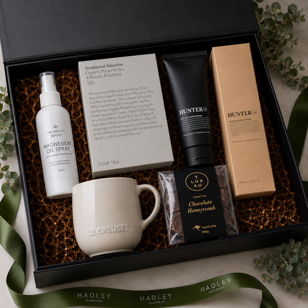 The Restorer get well gift hamper with tea, Le Creuset mug, self care and chocolate