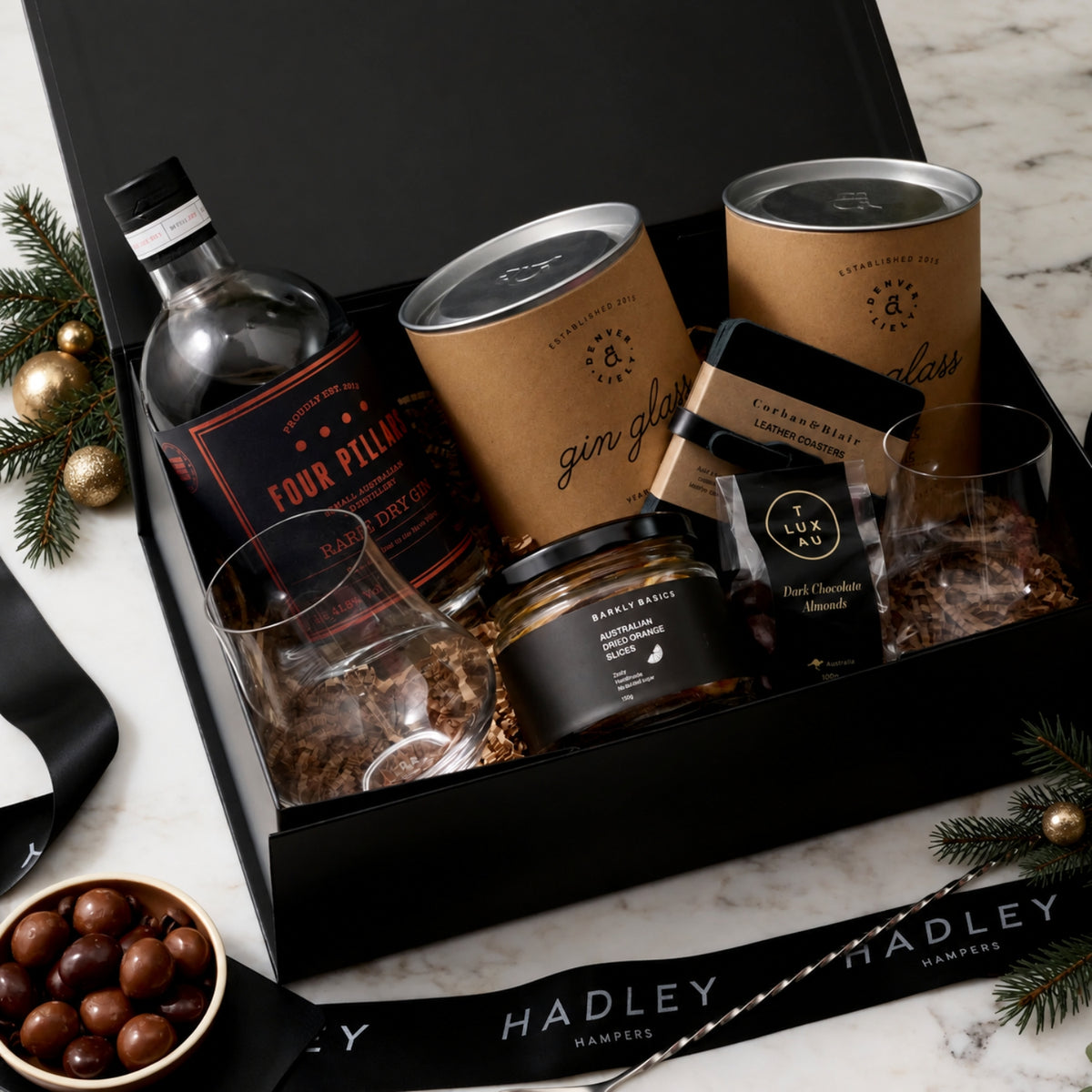 The Christmas Gin Artisan hamper with Four Pillars Rare Dry Gin, two hand-blown gin glasses and cocktail accessories