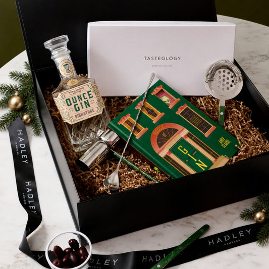 The Christmas Gin Stylist hamper with Ounce Signature Gin, House of Gin book and Tasteology cocktail tools in a black gift box