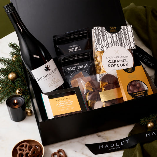 The Christmas Pinot Indulger hamper with Hoddles Creek Pinot Noir, artisan chocolates, caramel popcorn and gourmet treats.