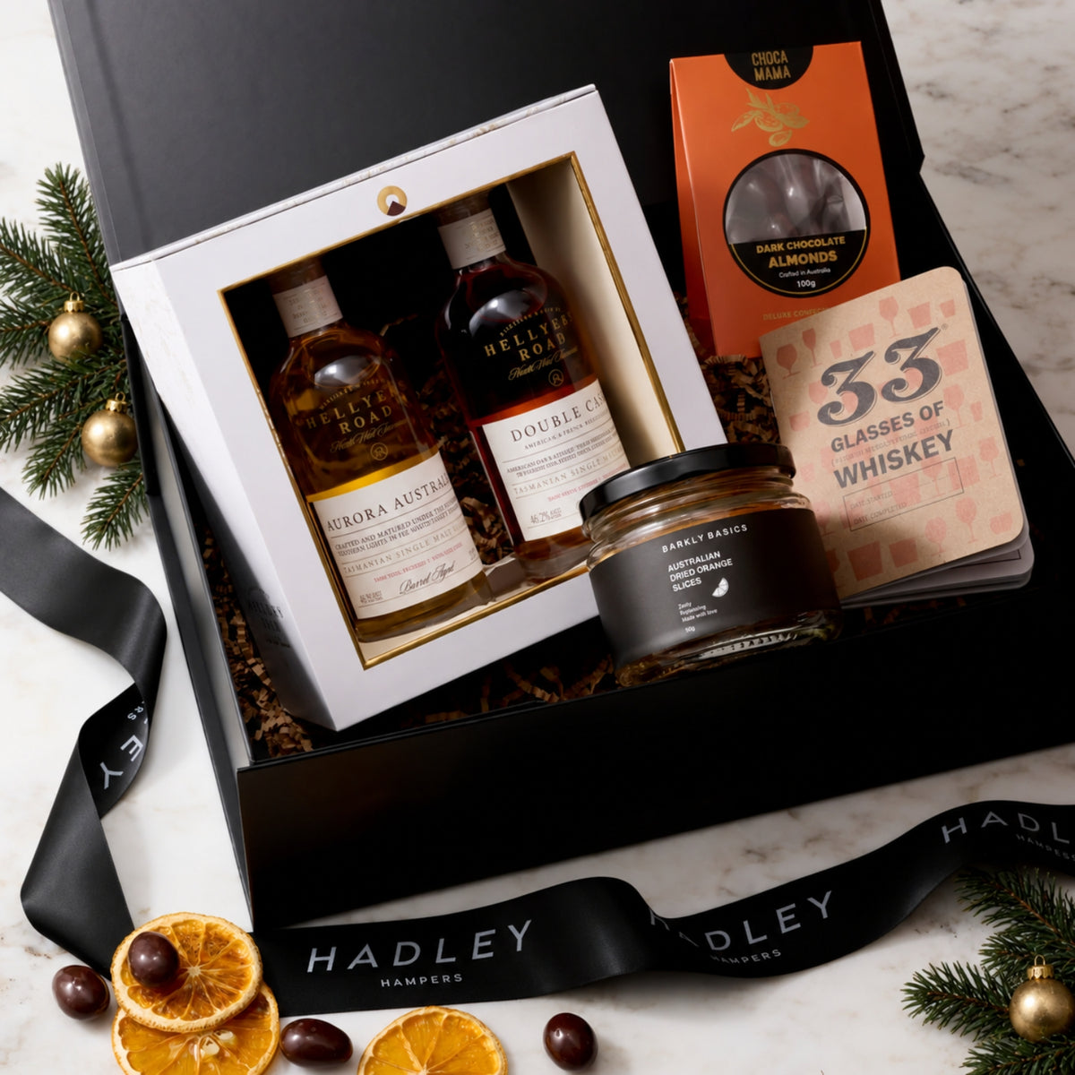 The Christmas Whisky Taster hamper with two Hellyers Road whiskies, dark chocolate almonds, dried oranges and a tasting journal