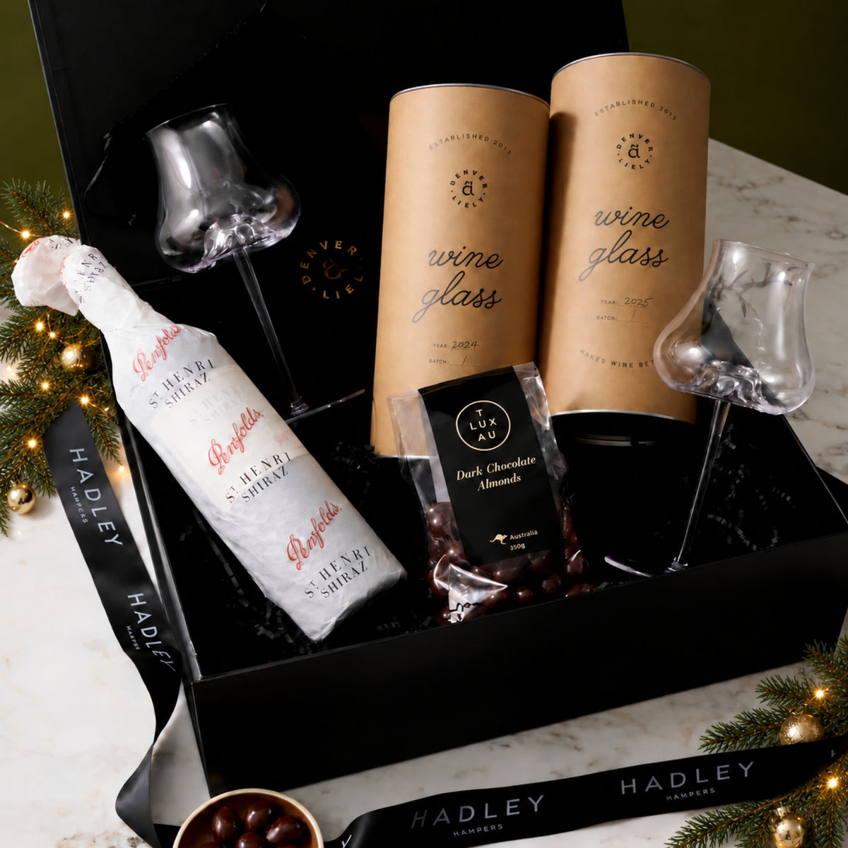 The Christmas Wine Collector hamper with Penfolds St Henri Shiraz, two Denver & Liely wine glasses and dark chocolate almonds
