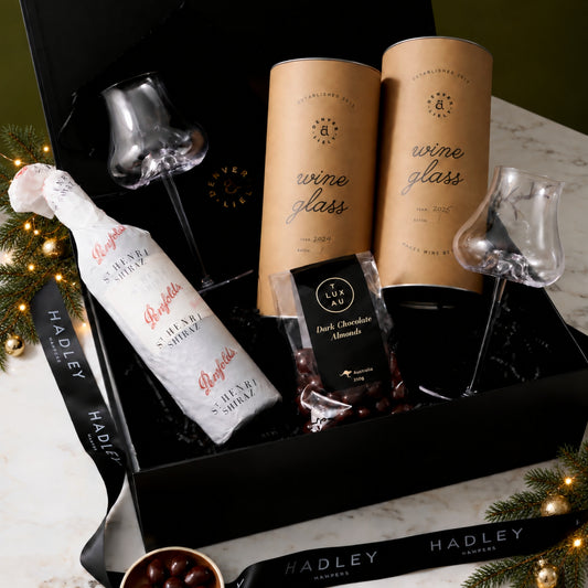 The Christmas Wine Collector hamper with Penfolds St Henri Shiraz, two Denver & Liely wine glasses and dark chocolate almonds