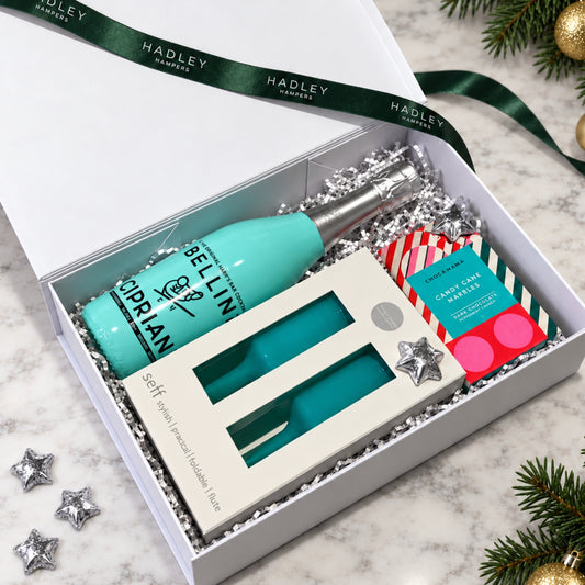 The Festive Bellini Toast Christmas hamper with Cipriani Bellini, two shatterproof flutes and festive chocolates in a white gift box